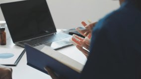 A dentist is using specialized dental equipment to inspect dentures to study the anatomy of the teeth before using the knowledge to treat patients, Dentures are being studied by oral specialists. - Powered by Shutterstock - Get 15% off with code: PIKWIZARD15