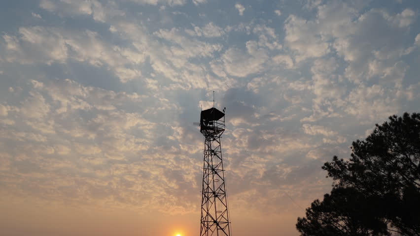 Remote Fire Observation Tower at Dusk, Forestry Protection and Risk Monitoring