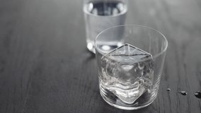 Slow motion making espresso tonic in tumbler glass, pour espresso over ice cube - Powered by Shutterstock - Get 15% off with code: PIKWIZARD15