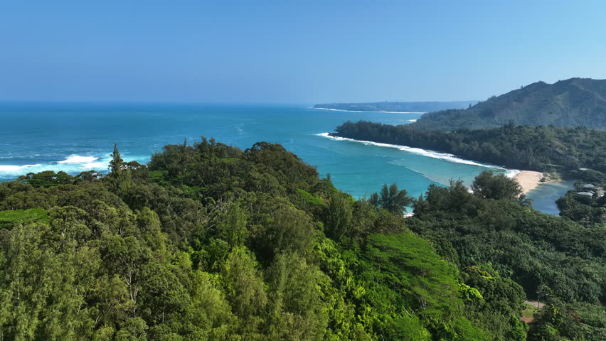 Aerial view approaching the Northshore beach, sunny day in Kauai, Hawaii, USA