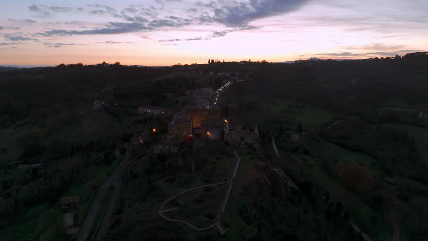 Celleno village surrounded by scenic countryside at sunset. Viterbo in Italy. Aerial orbiting