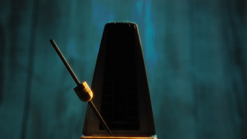 Mechanical Metronome Moving At Tempo 