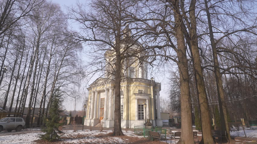 A Historical Pavilion Enveloped by Leafless Trees During the Winter Season