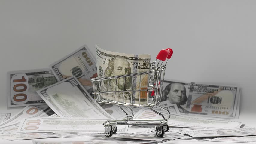 American one hundred dollar paper banknote fall in cart with money. 100 USD Bills. Concept Finance Business Investment Success. Concept Finance Business Investment Success. United States money.