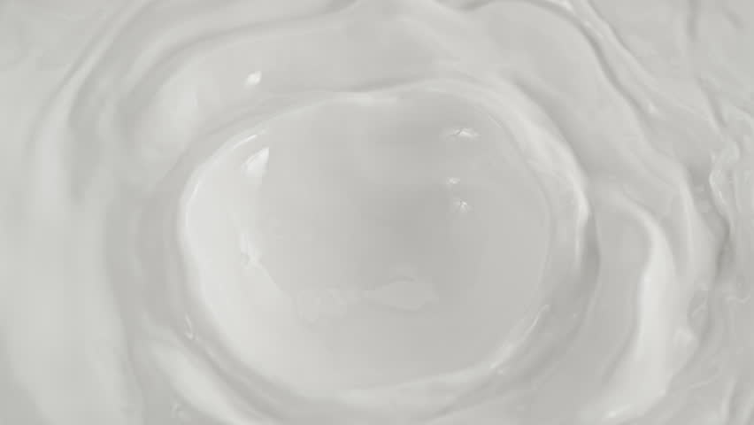 Super Slow Motion Shot of Pouring and Splashing Fresh Milk at 1000 fps.