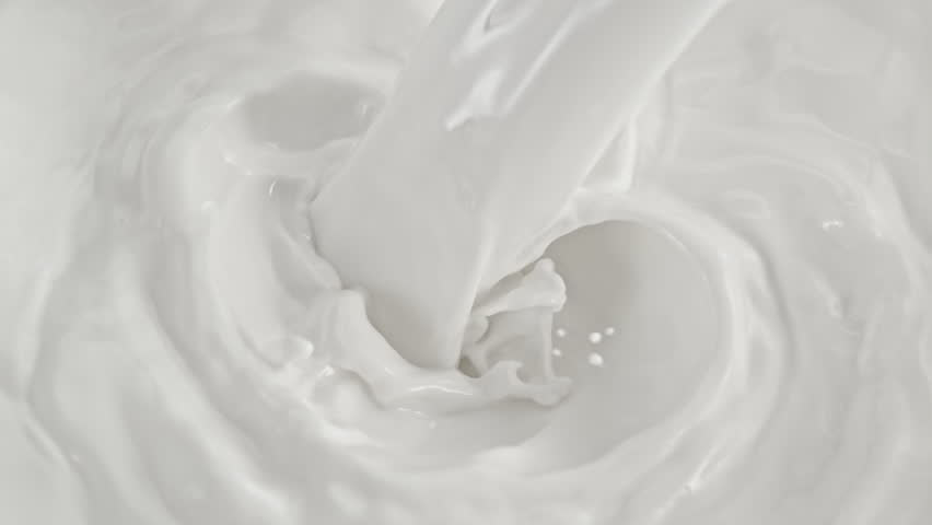 Super Slow Motion Shot of Pouring and Splashing Fresh Milk at 1000 fps.