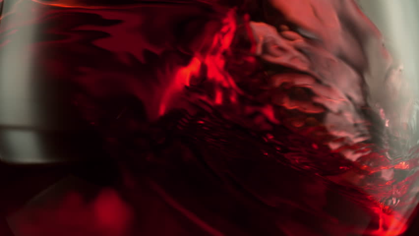 Super Slow Motion Macro Shot of Spinning Red Wine in Glass at 1000fps.