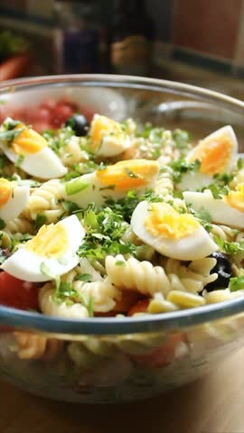 Top-down shot of a bowl of fusilli salad.