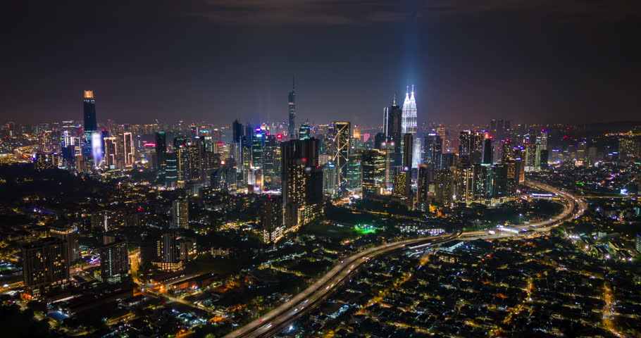 Aerial night hyperlapse of Kuala Lumpur city skyline and traffic, Malaysia