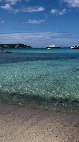 Turquoise sea waves on the beach of Sardinia 