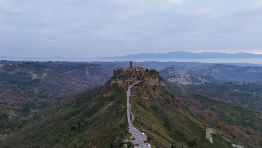 Historic Civita di Bagnoregio and stunning landscape from above, Viterbo in Italy. Aerial drone approach, copy space