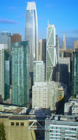 Aerial view of San Francisco skyline. Famous skyscrapers over a blue sky. Interstate 80 full of traffic. California, United States. Shot on Red weapon 8K.
