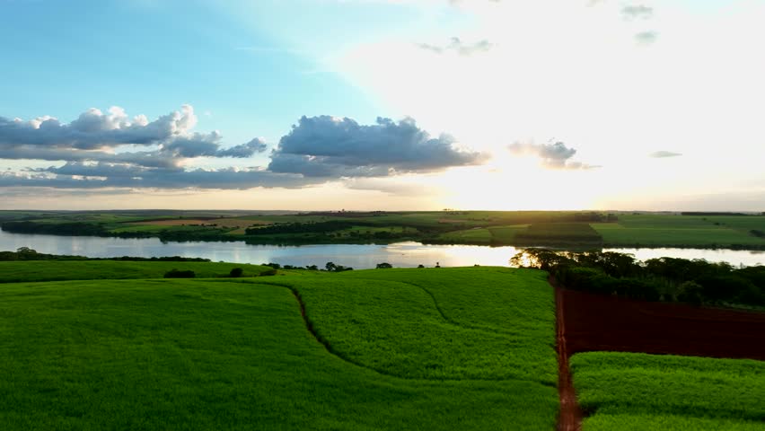 aerial view of sugarcane fields and Tiete River at dusk