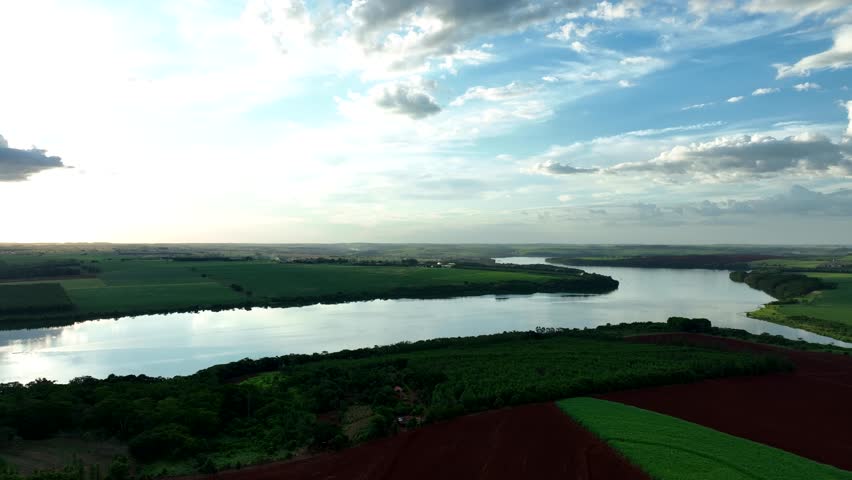 aerial view of sugarcane fields and Tiete River at dusk