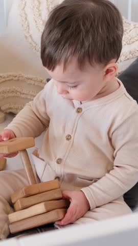 Little Baby Playing With Wooden Pyramid At Home