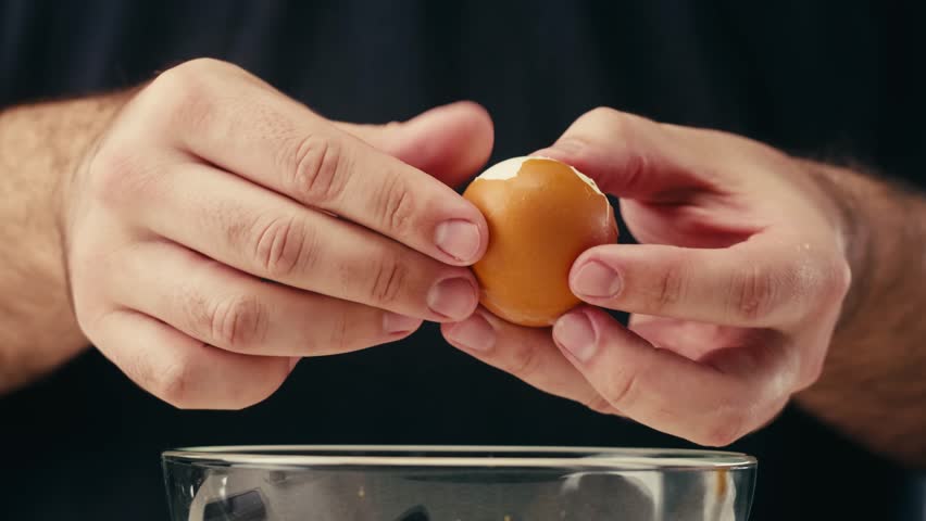 Grater and eggs, woman grates boiled egg for salad, cooking food.