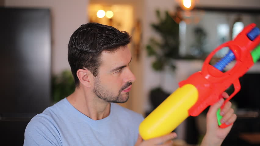 Funny man with his water-gun