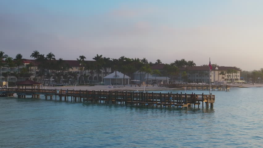 Experience the breathtaking and stunning aerial view of Sunset Key in Key West, Florida, which showcases serene waters, beautiful sandy beaches, and vibrant coastal architecture