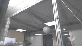 Chandelier Swinging During Earthquake Simulation – Indoor Seismic Testing with Reflections on Glass - Powered by Shutterstock - Get 15% off with code: PIKWIZARD15