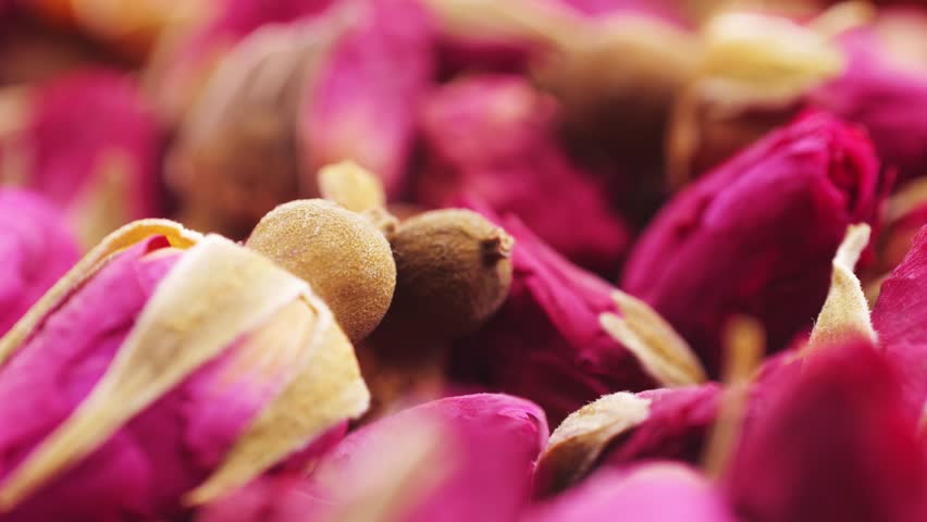 Dried rose bud tea texture background, Healthy herbal tea macro texture close up. 