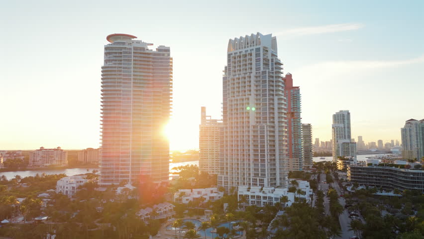 Stunning sunset aerial shot shows Miami Beach iconic skyline and coastline. Experience luxury travel on South Beach, the ideal summer getaway for relaxation, excitement, and adventure. Florida, USA