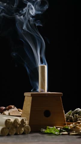 traditional Chinese medicine moxa moxibustion sticks on table.