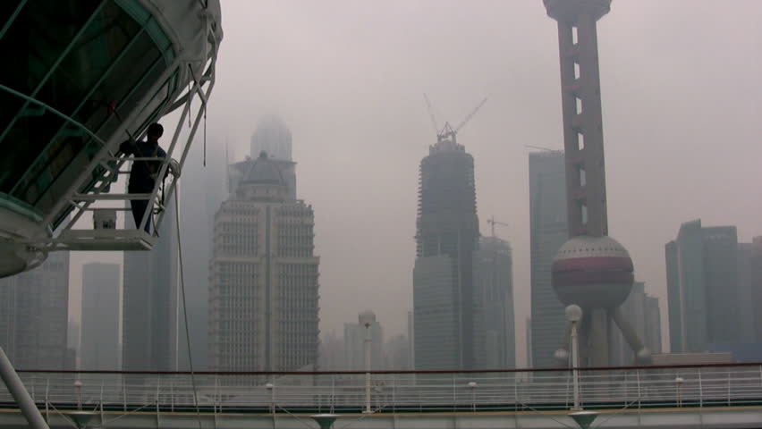 Shanghai. Early misty morning. In the background - the skyscrapers. Their tops