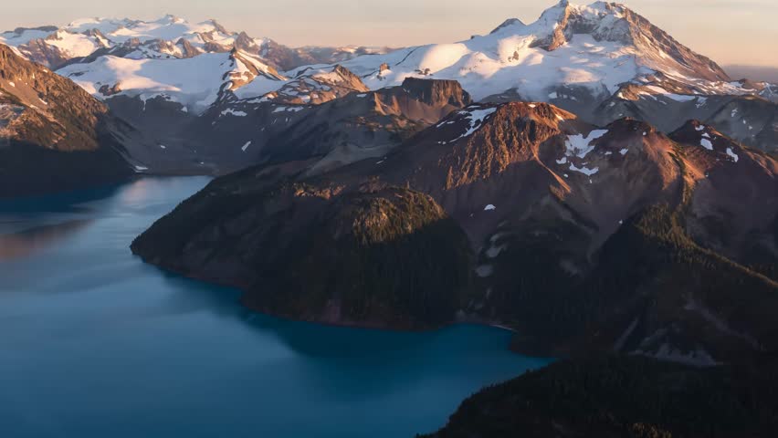 Garibaldi Lake and surrounding mountains in British Columbia, Canada at sunset.