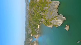 Vertical video. Aerial view of scenic limestone rocky islands on Ha Long Bay in Vietnam - Powered by Shutterstock - Get 15% off with code: PIKWIZARD15