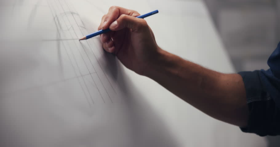 Hands, architect and drawing with closeup, board and lines for creativity, editing or process at company. Person, engineer and paper with pencil, writing or sketch with project management at agency