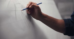 Hands, architect and drawing with closeup, board and lines for creativity, editing or process at company. Person, engineer and paper with pencil, writing or sketch with project management at agency - Powered by Shutterstock - Get 15% off with code: PIKWIZARD15