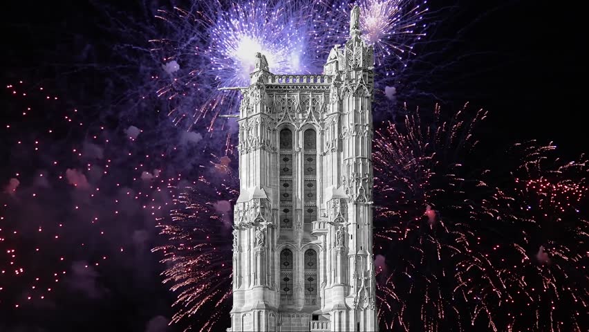 Celebratory colorful fireworks over the Saint-Jacques Tower (Tour Saint-Jacques). Located on Rivoli street, Paris, France. This 52 m Flamboyant Gothic tower (XVI century).  4K, time lapse