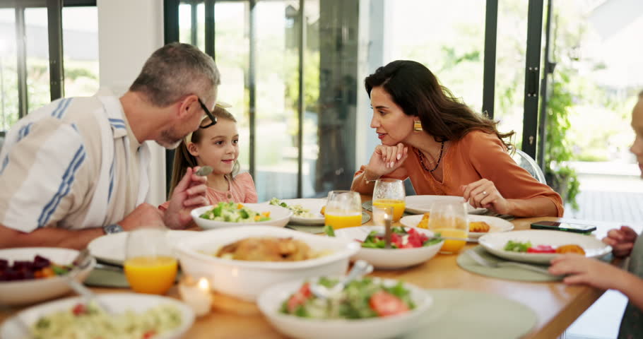 Laughing, food and health with family in dining room for nutrition, love and bonding. Funny, wellness and lunch with parents and children eating at home for happiness, hungry and support together
