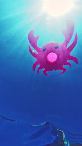 Pink inflatable crab toy floating in sunlit swimming pool, underwater view.