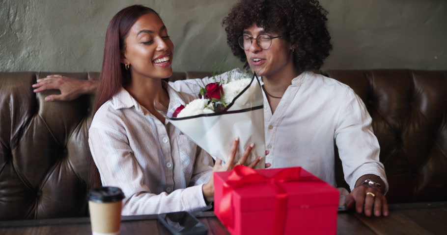 Surprise, flowers and couple with gift, restaurant and celebration of valentines day, romance or smile. Commitment, woman and man with present for anniversary, giving or bonding with package for date