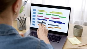 Woman looking at screen with calendar and dates. Concept of planning business meetings and events. Organization of time management. - Powered by Shutterstock - Get 15% off with code: PIKWIZARD15