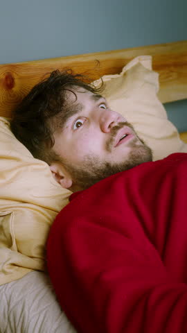 Man Waking Up in Shock After a Nightmare – Sleep Paralysis or Sleep Apnea Reaction ,vertical video