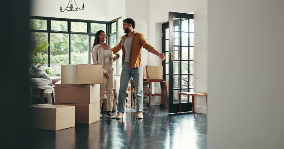 Planning, ideas and couple with boxes in new home for property, moving and interior design. Homeowner, real estate and happy man and woman hug and talking with mortgage, house purchase and apartment