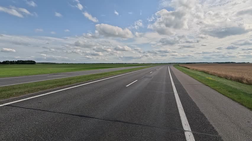Beautiful landscape, road markings, roadsides and road lines on a summer day.