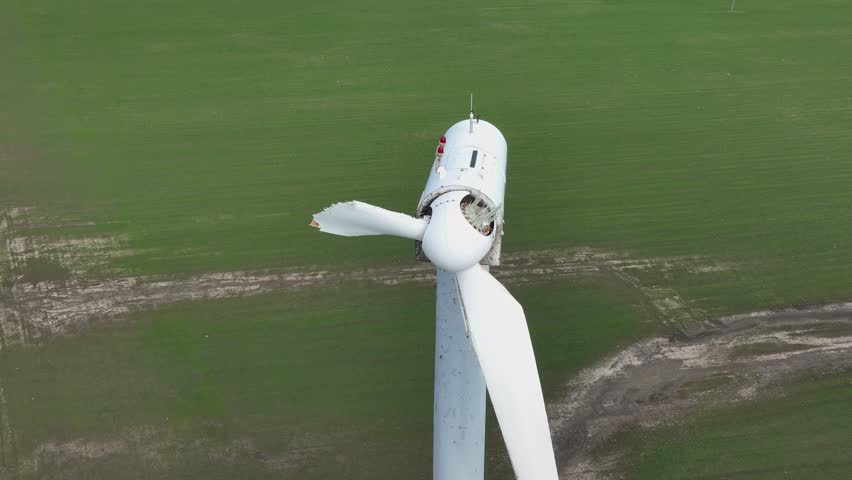 Close-up of a destroyed wind turbine generator. Strong winds and high speeds break the propellers. Destroyed infrastructure Disaster. Windmill, energy production