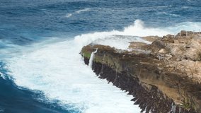 Waves crashing on rocks, drone view with blue ocean - Powered by Shutterstock - Get 15% off with code: PIKWIZARD15