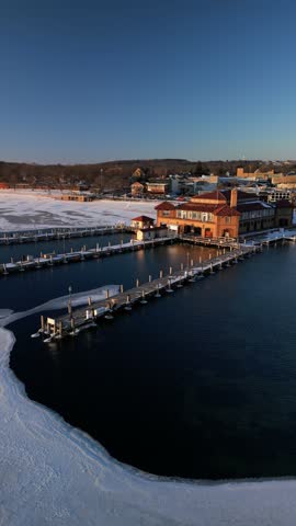 Orbiting Drone Shot Above The Riviera on Lake Geneva, Wisconsin. Winter. Vertical