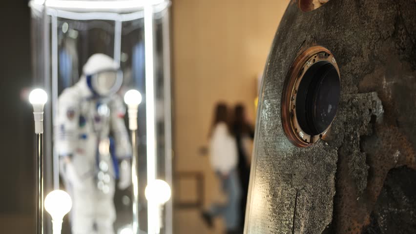 Soyuz descent module and spacesuit showing space exploration history