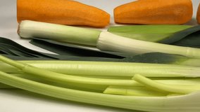 Leek, celery and carrots lie on a white table, root vegetables - Powered by Shutterstock - Get 15% off with code: PIKWIZARD15