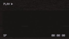 Old VHS camera interface with noise and flickering. VHS recording with time code. VCR play symbol. VHS defects and artifacts. Old damaged tape cassettes. Retro vintage background. VCR interface. - Powered by Shutterstock - Get 15% off with code: PIKWIZARD15