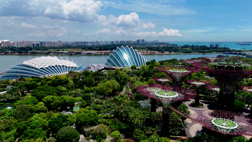 Gardens by the Bay in Singapore. Botanical garden with supertree grove. Aerial 4K drone video footage