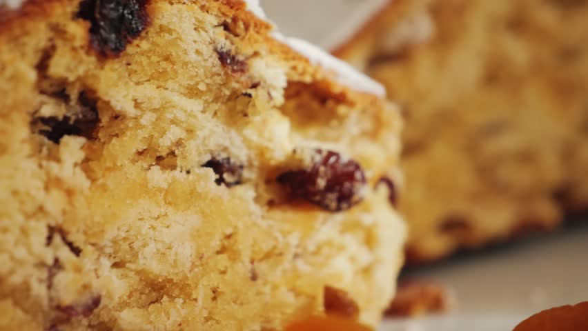 A piece of cake with raisins on the table served for tea. Close-up pie texture. High quality 4k footage