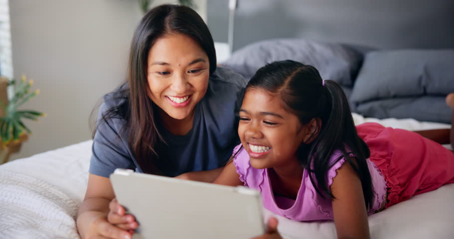 Tablet, mother and kid laugh in bedroom for movie, comedy show or watch cartoon together in family home. Child, girl or mom with digital technology for learning online, game app or reading funny meme