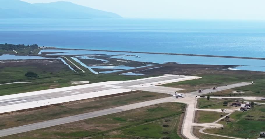 Aerial drone shot on airplane impressive take off flying. aerial drone footage. side view to modern aircraft taking off. Best amazing shot for your project. Day time in airport. Greece, Kavala