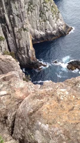 Tasmania towering sea cliffs on the ocean